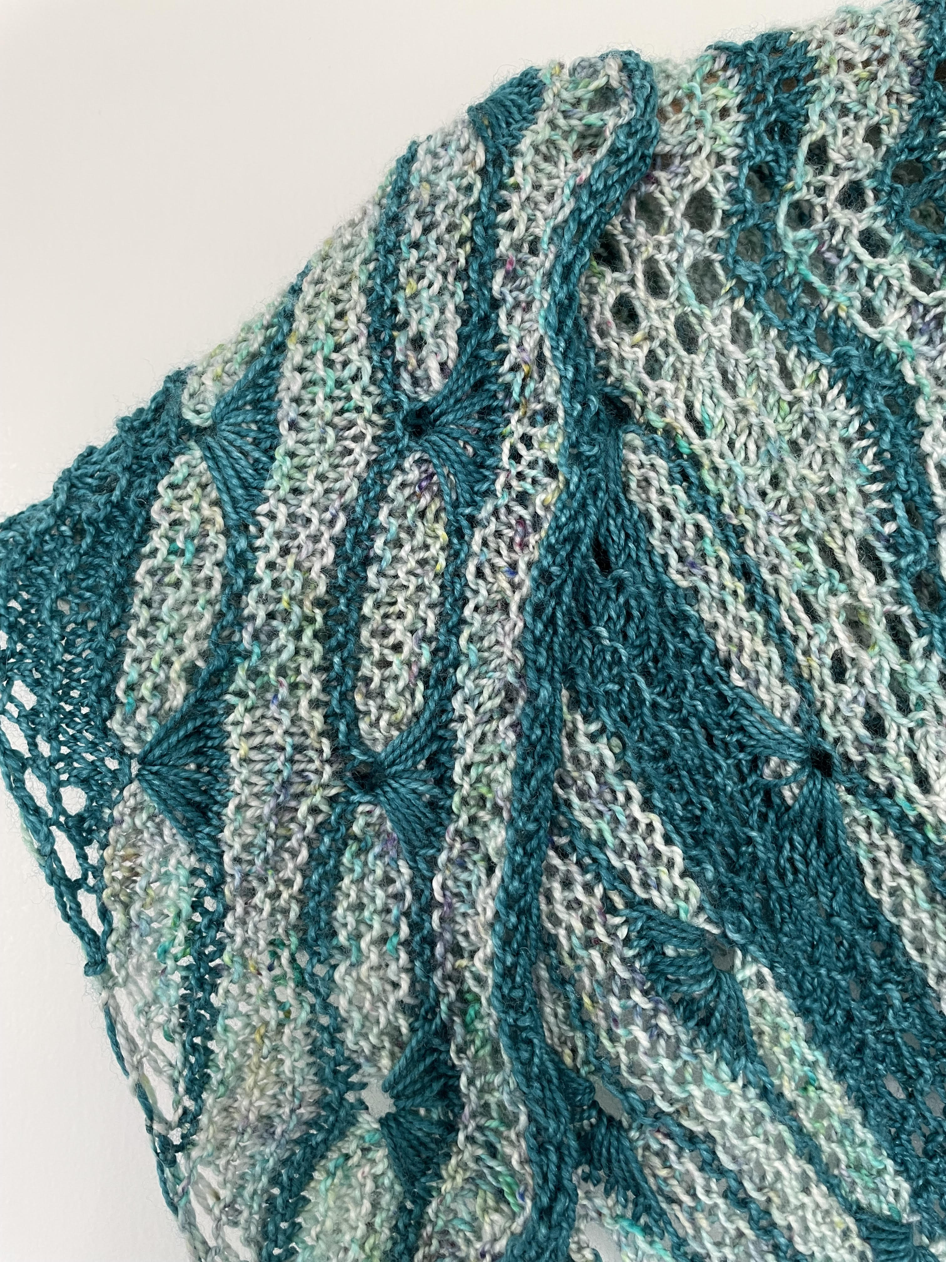 handknit shawl in teal and varigated yarn